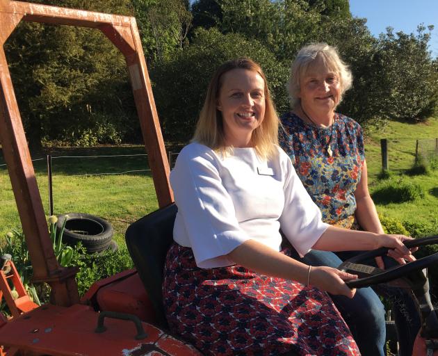 Greater Green Island Community Network worker Amanda Reid (left) and Green Island Community Garden co-ordinator Marion Thomas on the tractor in the garden where fruit trees, funded by the Otago Community Trust, will be planted. PHOTO: SHAWN MCAVINUE