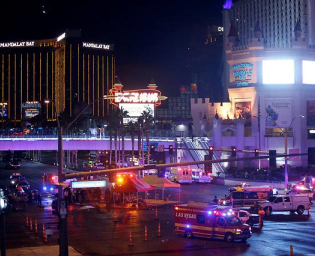 Las Vegas Metro Police and medical workers stage after a mass shooting at a music festival on the Las Vegas Strip. Photo: Reuters
