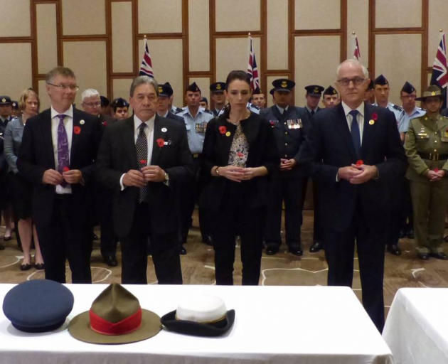 Preparing to lay poppies, from left, David Parker, Winston Peters, PM Jacinda Ardern and...