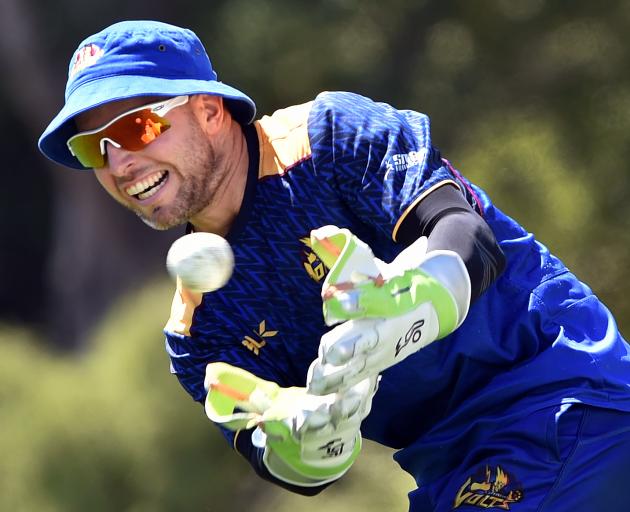 Otago wicketkeeper Derek de Boorder gloves the ball during a training session at the University...