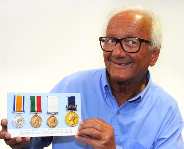 Journalist Stephen Freed holds medals belonging to his grandfather, Captain Gerald Doorly. Photo: Christine O'Connor