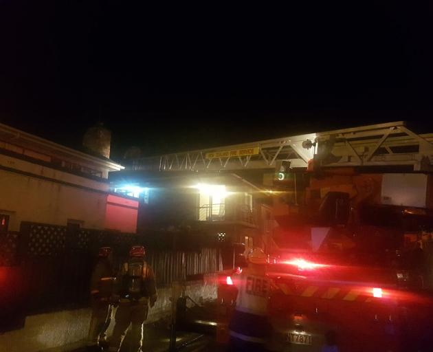 Firefighters outside a student flat this evening. Photo: Vaughan Elder