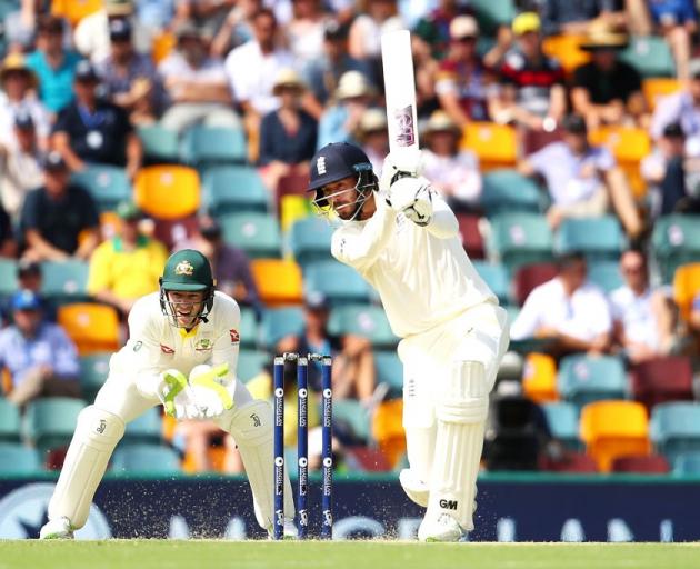 England's James Vince plays the ball through the offside on day one of the first Ashes test at...