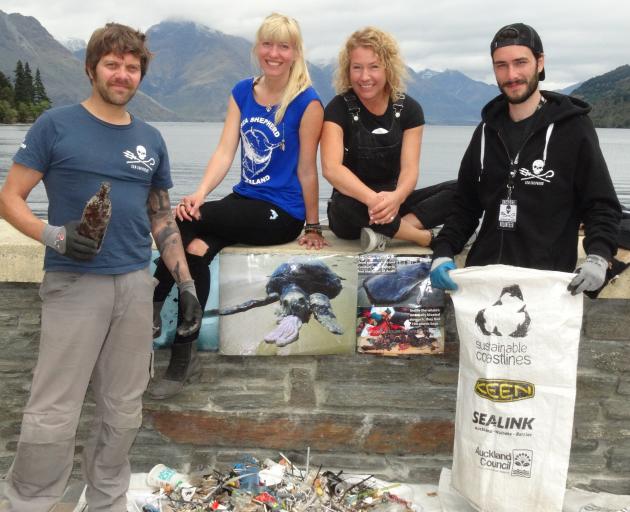 Cleaning up Queenstown's waterfront on Saturday were (from left) co-ordinator Rob Dickinson and...