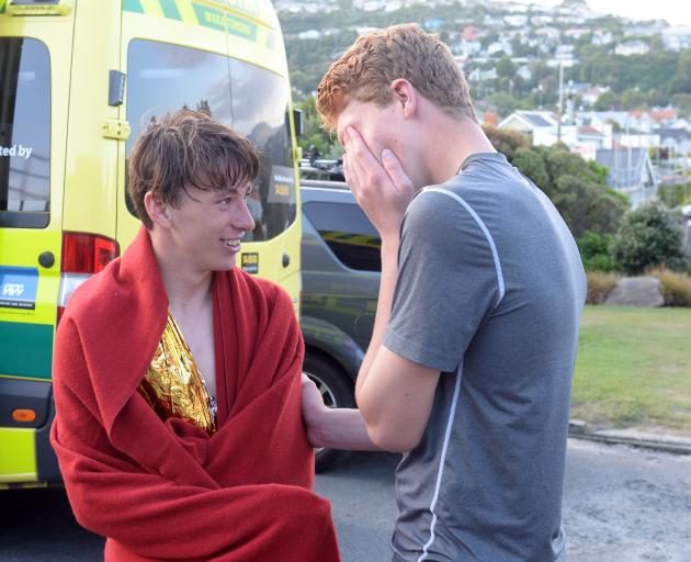 Recovering at the St Clair Surf Lifesaving Club are Aidan MacRae (left) and Chris MacDonald after their close encounter with a 2m-long shark off Second Beach last night. Photo: Linda Robertson