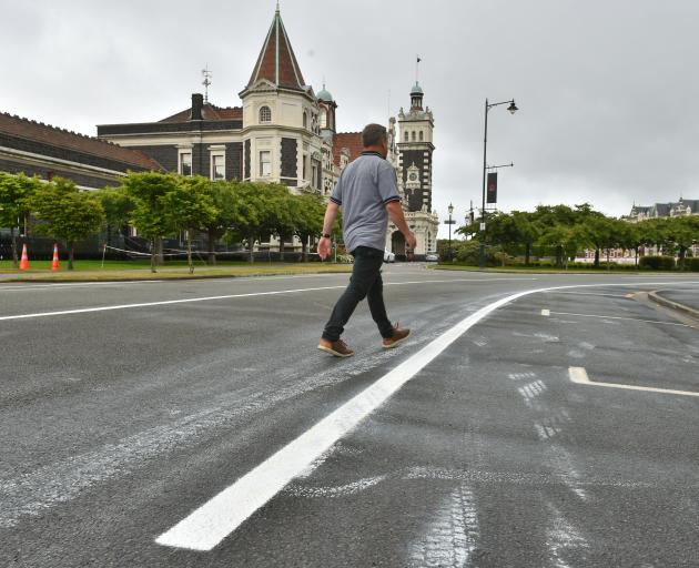 Fresh road-marking paint is smeared in Anzac Ave, Dunedin. PHOTO: GREGOR RICHARDSON
