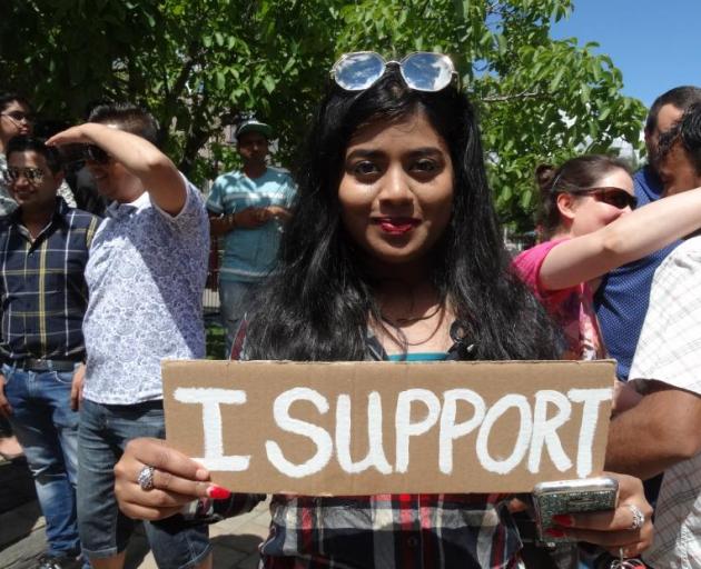 Marcher Thvshe Ulhas shows support. Photo: ODT