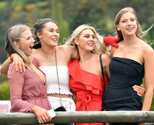 From left Emily Rades (19), Isla Huffadine (19), Millie Anderson (19) and Olivia Barber (18), all of Dunedin, enjoy the   Melbourne Cup day at Wingatui  yesterday. Photo: Peter McIntosh