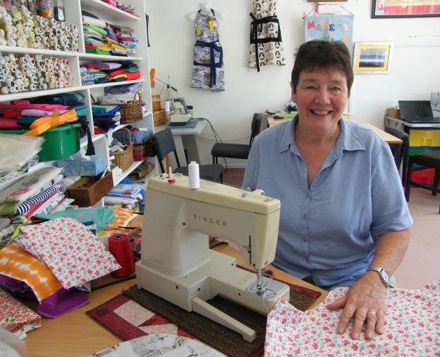 The previous Naseby Store owner Marilyn Swinbourn works in the sewing room she operated from the...