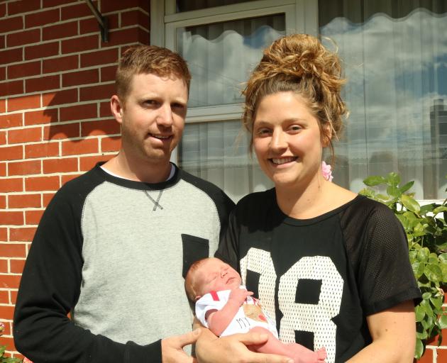 Nathan and Belinda White with their new daughter, Summer, on her first trip outside. Photo: Tom Kitchin