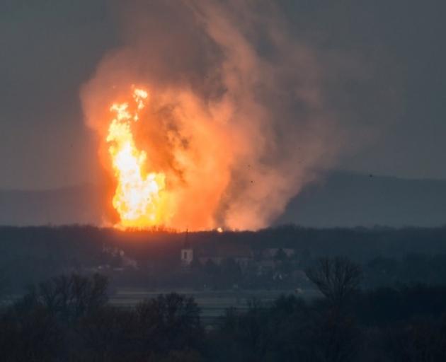 A column of fire is seen after an explosion ripped through Austria's main gas pipeline hub in Baumgarten. Photo: Reuters A column of fire is seen after an explosion ripped through Austria's main gas pipeline hub in Baumgarten. Photo: Reuters