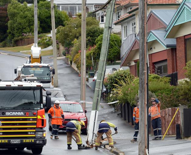 Emergency services and Delta attend an accident where a car collided with a power pole in Barr St, Dunedin. Photo: Linda Robertson Emergency services and Delta attend an accident where a car collided with a power pole in Barr St, Dunedin. Photo: Linda Robertson