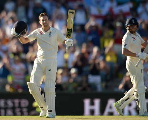 Dawid Malan celebrates his century on day one of the third Ashes test in Perth yesterday. Photo:...