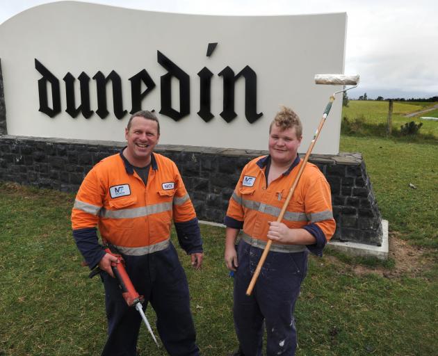 Nick Poole (left) and Michael Cotter, of Moran Fabrication, complete work on the Dunedin city boundary sign, near Allanton yesterday. Photo: Christine O'Connor