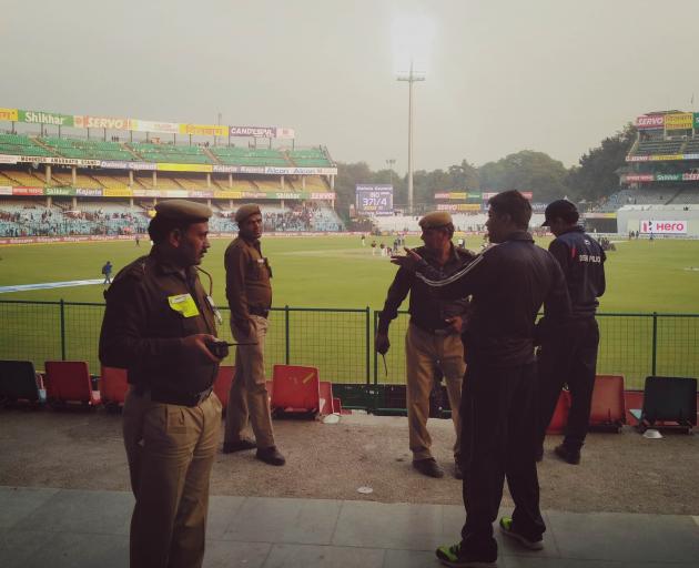 Indian Policemen standing guard during 1st day of 3rd Cricket Test match between India and...