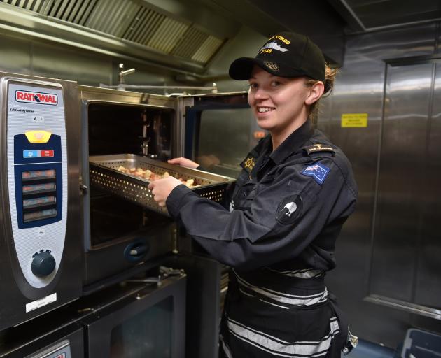 Able Chef Rianna Palmer, of Mosgiel, at work in the galley of HMNZS Otago which leaves the Birch St wharf today. Photo: Gregor Richardson