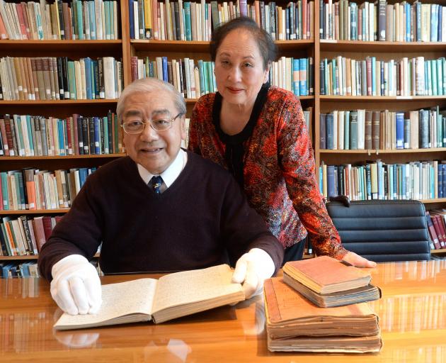 Historian Dr Jim Ng and his wife Eva looks at adiary from the Ng New Zealand Chinese Collection at Knox College, in Dunedin, yesterday. PHOTO: LINDA ROBERTSON