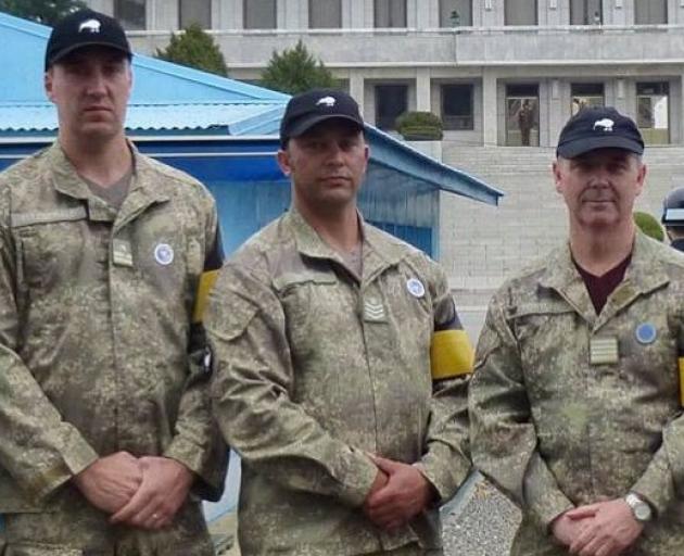 Staff Sergeant Aaron Giles (centre), from Gore, pictured with other NZDF personnel in South Korea...