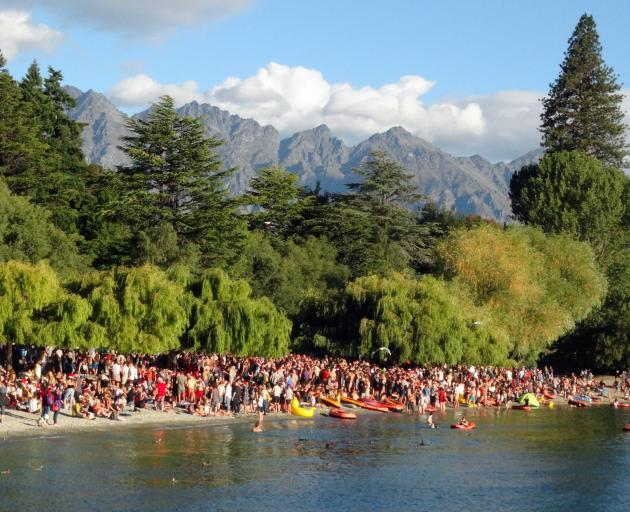 Hundreds of people gathered on the beach at Queenstown Bay on Christmas Day. Photo: Louise Scott