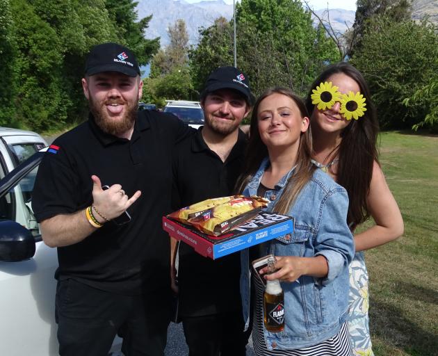 Domino’s Queenstown staff Eric Boynton (left) and Quinn Blunden deliver food to Crate Day...