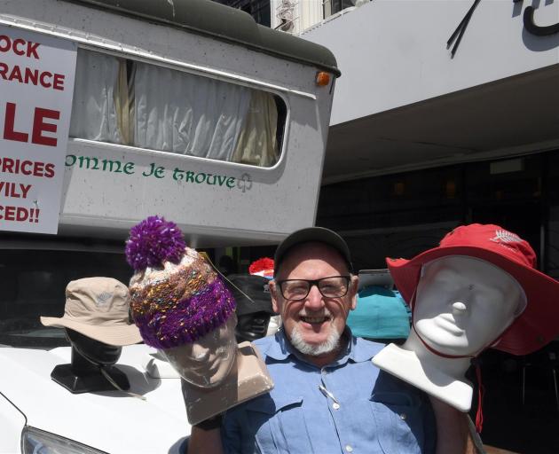 Selwyn Shanks shows some of the merchandise being sold from his camper van in lower Stuart St, much to the ire of a neighbouring Dunedin business. Photo: Stephen Jaquiery