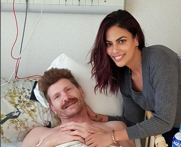 Adam Thomson pictured with partner Jessie Gurunathan in the Tsukuba Memorial Hospital in Tokyo. Photo: Instagram