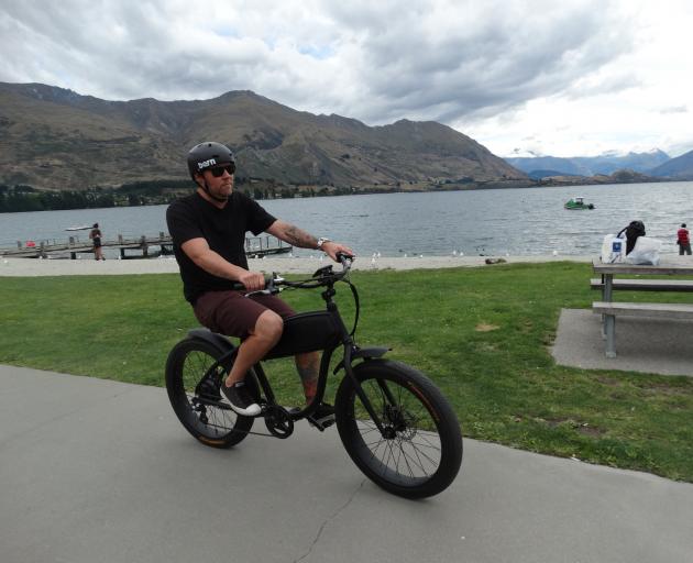 Wanaka electric bike company Anticus Bikes co-owner Andrew Thurnham rides a 1920s-inspired e-bike that he believes fills a gap in the market. Photo: Kerrie Waterworth