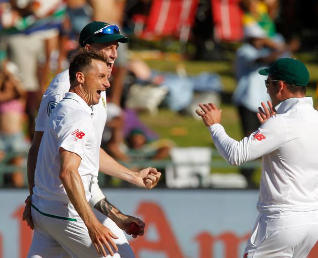  South Africa's Dale Steyn celebrates with team mates after making a catch to dismiss India's...