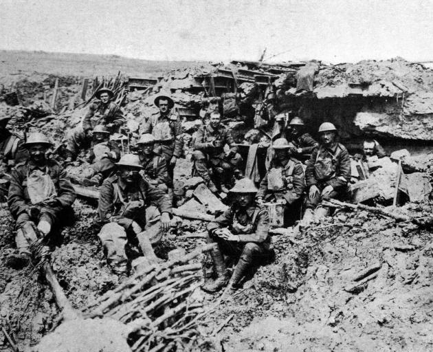 British guardsmen outside a smashed German machine-gun emplacement. - Otago Witness, 2.1.1918. 
