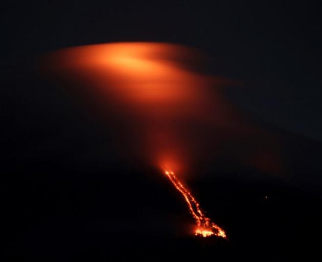 Reddish glow of lava drifting towards southwest part of Mayon volcano in Camalig town, Albay province, south of Manila. Photo: Reuters