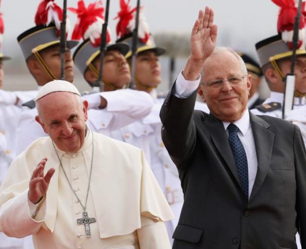 Pope Francis and Peru's President Kuczynski wave, in Lima. Photo: Reuters