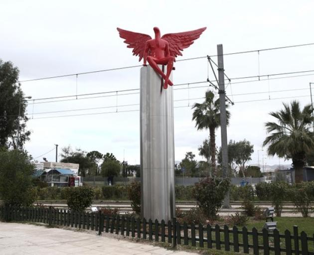 A red angel-shaped statue called 'Phylax' by Greek artist Kostis Georgiou is seen in southern Athens. Photo: Reuters