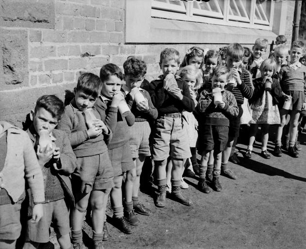  Pupils line up to quaff their free school milk at an Otago school in 1950. PHOTO: EVENING STAR