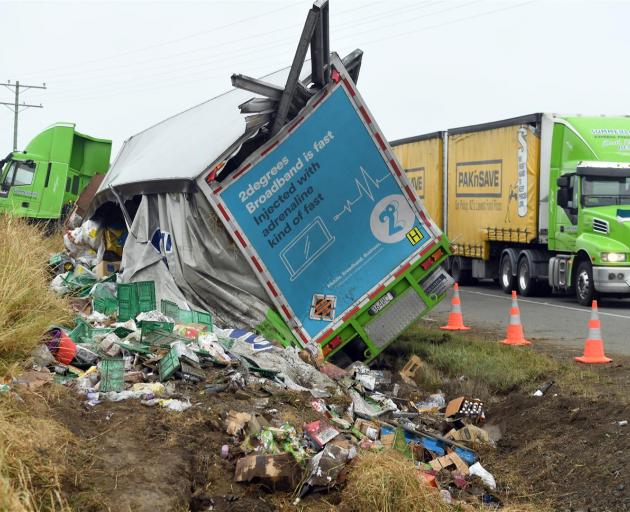 A Summerland Express Freight truck lost its load of groceries after crashing on State Highway 1 near Palmerston yesterday. Photo: Stephen Jaquiery