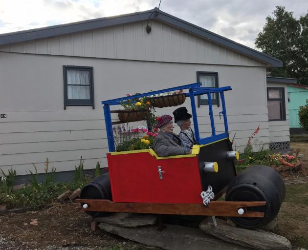 A large model car, designed and built by Keith Hobden, on display at the front of his Middlemarch property. Photo: Supplied