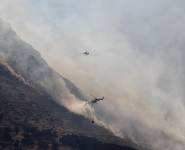 The At Alpha fire near Wanaka at its peak, with up to eight choppers in the air at once fighting...