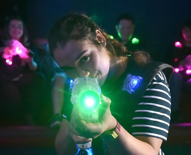 Otago University Laser Tag Society member Michelle Lindsay (19, front) hits her mark with the support of team-mates Sarvana Kinghorn (left), Joel Bartlett (26) and Angelique Montalba (19). Photo: Gregor Richardson