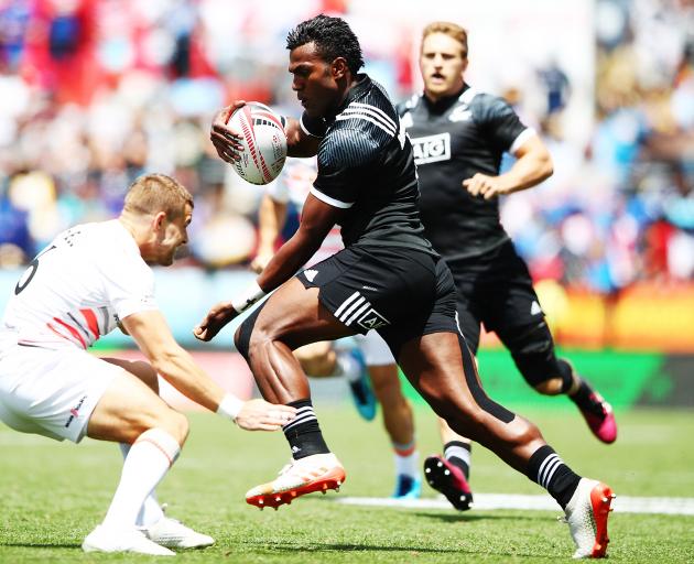 Joe Ravouvou of New Zealand makes a break against England during the 2018 New Zealand Sevens. Photo: Getty Images