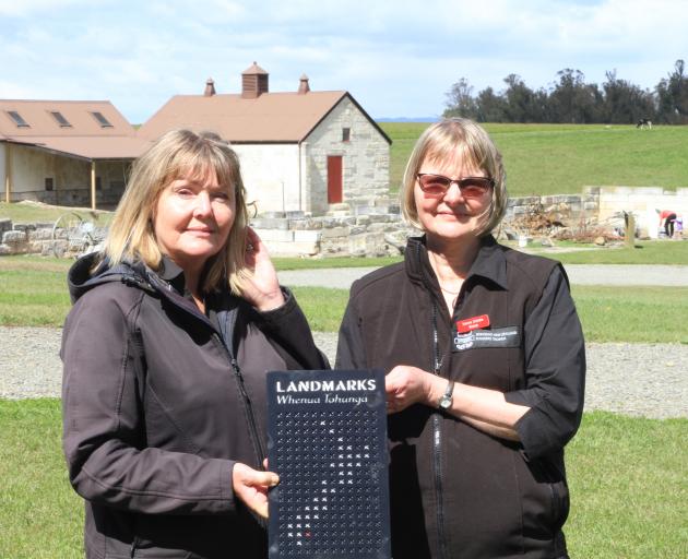 Incoming Heritage New Zealand Totara Estate property lead Keren Mackay (left) and outgoing property lead Anne Sutherland celebrate the official recognition of the Landmarks Whenua Tohunga status of Totara Estate, near Oamaru, yesterday. Photo: Hamish MacL