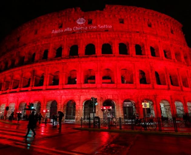 The Colosseum is lit up in red to draw attention to the persecution of Christians around the world in Rome. Photo: Reuters