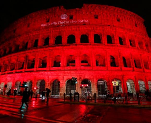 The Colosseum is lit up in red to draw attention to the persecution of Christians around the world in Rome. Photo: Reuters The Colosseum is lit up in red to draw attention to the persecution of Christians around the world in Rome. Photo: Reuters
