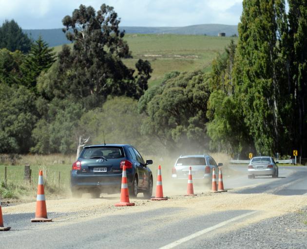 Gravel patches temporarily fill holes in Factory Rd, Mosgiel. Photo: Linda Robertson