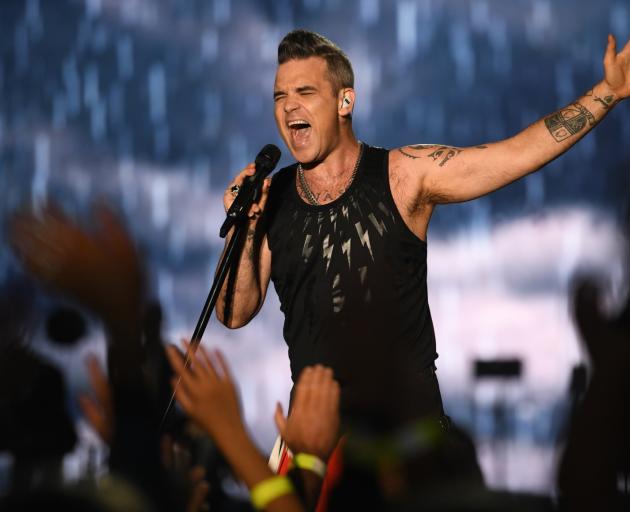 Robbie Williams rocks the 16,000-strong crowd at Forsyth Barr Stadium in Dunedin on Saturday...