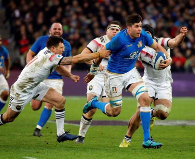 Italy’s Sebastian Negri in action with France’s Remy Grosso during the France and Italy Six Nations match. Photo: Reuters
