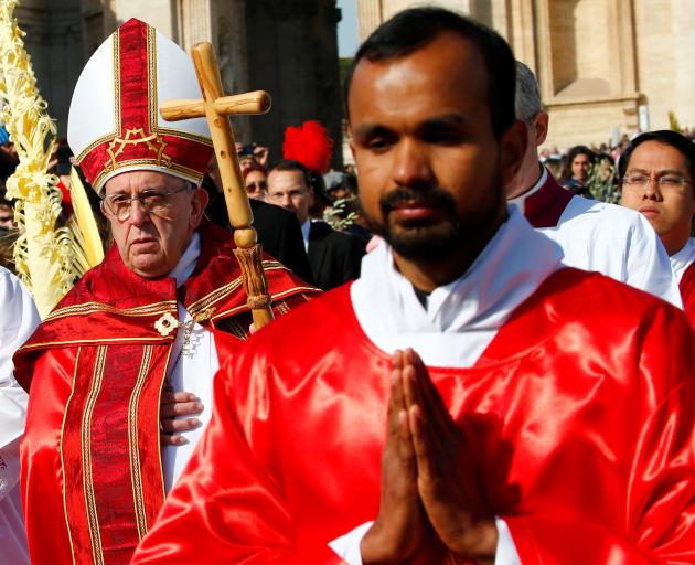 Pope Francis (left) arrives to lead Palm Sunday Mass in Saint Peter's Square. Fr Michael believes the new Pope could usher in a better, if less comfortable, era. Photo: Reuters