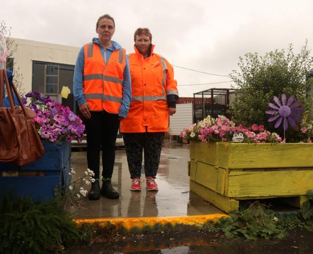 Wastebusters site manager Lauree O'Neil and shop assistant Val Joyce stand on the site of the...