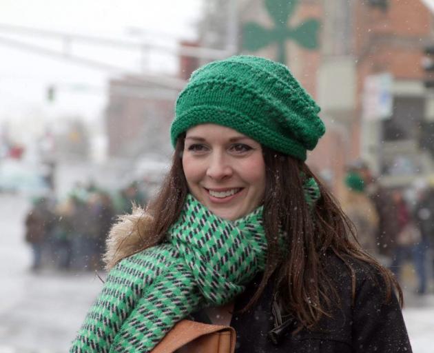 A parade-goes wraps up in green to ward off the cold on Park St. Photo: Gwyneth Hyndman