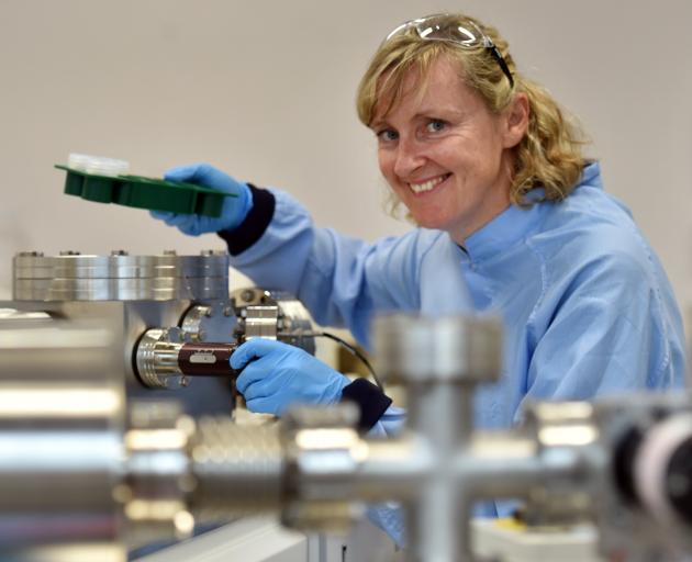 Prof Claudine Stirling with a mass spectrometer machine at the University of Otago chemistry...