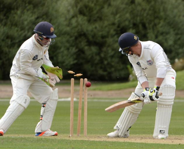 Auckland batsman Glenn Phillips is bowled by Otago left-arm spinner Michael Rippon at the...