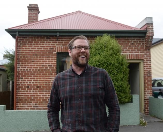 Damian Barr outside the Robert Lord cottage in Dunedin. Photos: Linda Robertson